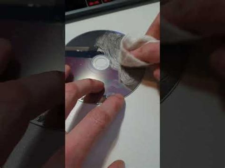 How do I repair a scratched game disc?