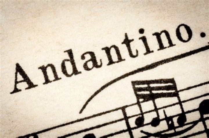 In music what does andantino mean?