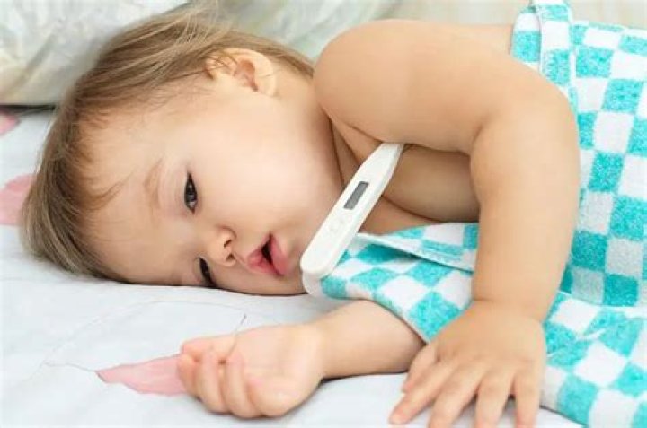 Should i undress my baby with a fever?