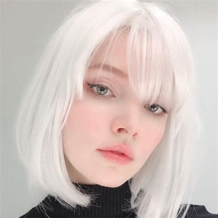 Who is the girl with white hair that also wears a black thing over her eyes?