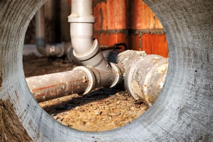 Why are the sewage pipes "backed up" if much capacity still exists?