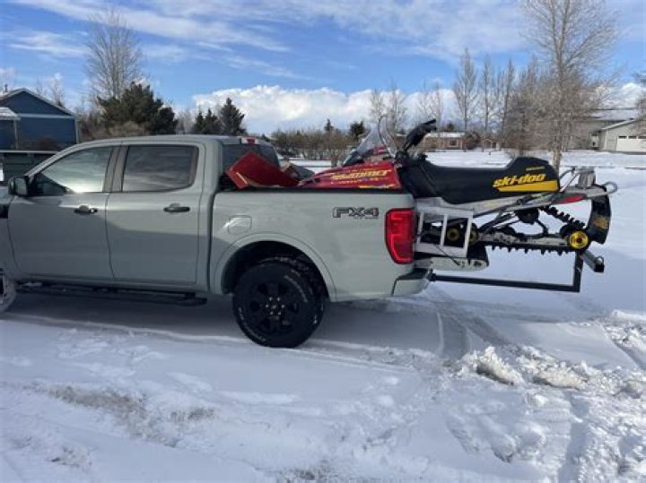 Will a snowmobile fit in a tacoma?